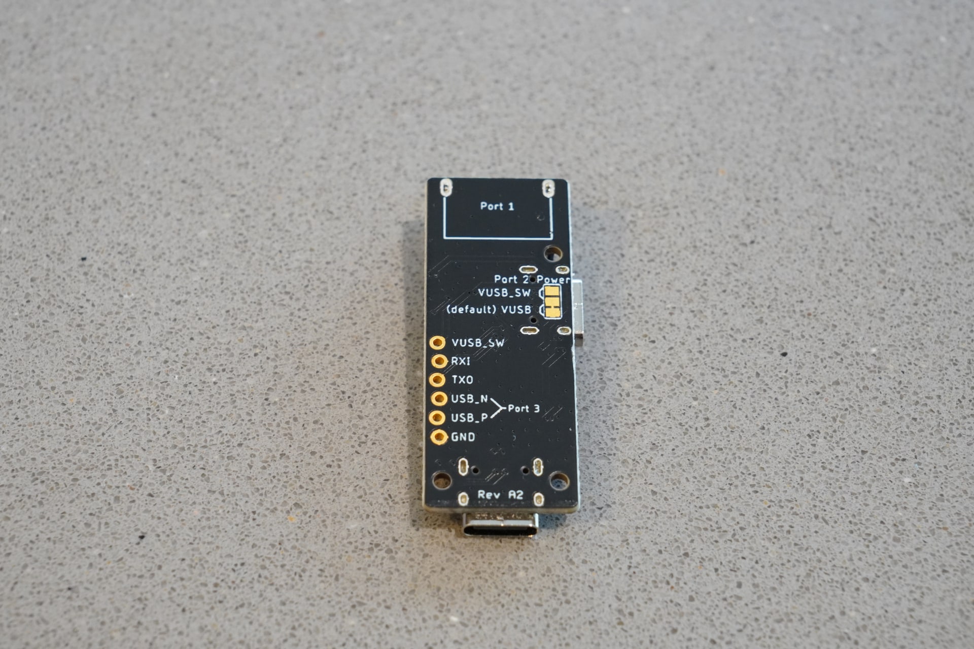 Bottom view of pt1 showing the port labels and six-pin header pinout