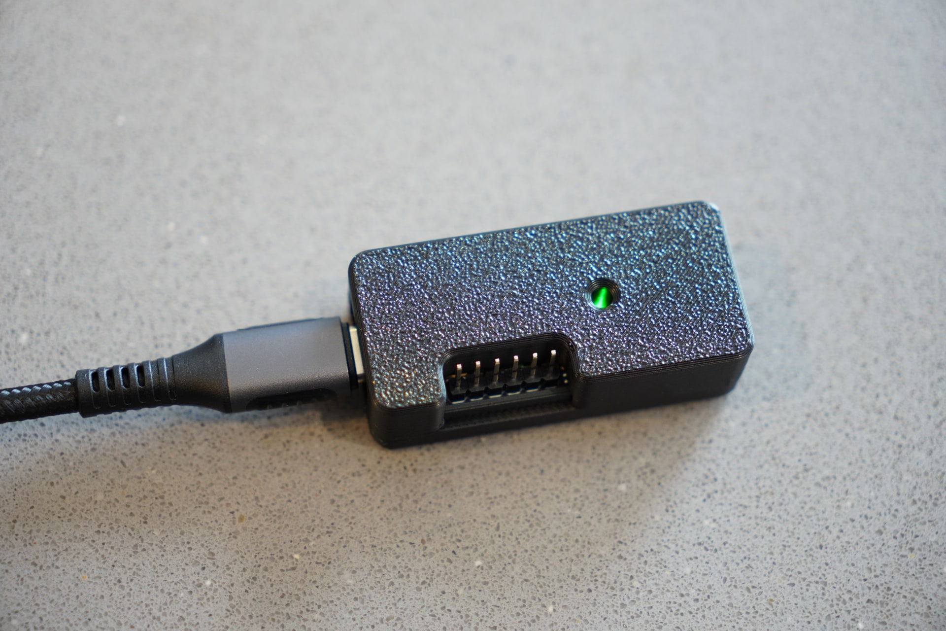Assembled pt1 in its 3D-printed case with a USB-C cable connected